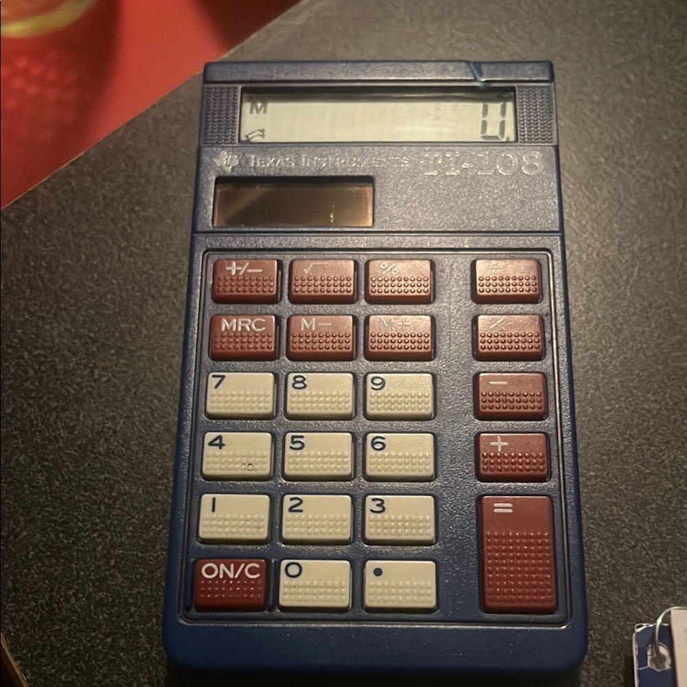 Texas Instruments Blue and Red Calculator